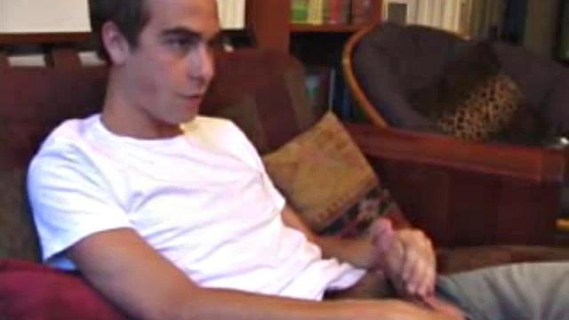 Vincenzo shows off his new purchase, strokes his cock, and uses a sex toy on the couch