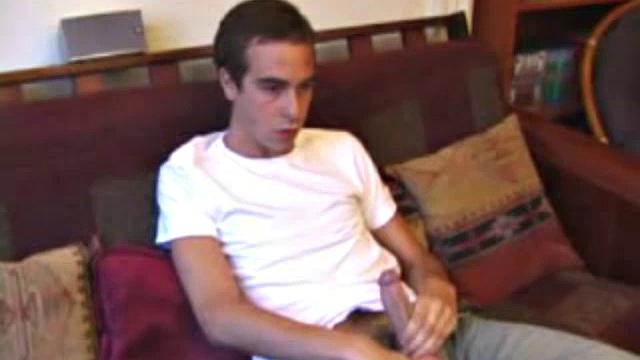 Vincenzo shows off his new purchase, strokes his cock, and uses a sex toy on the couch