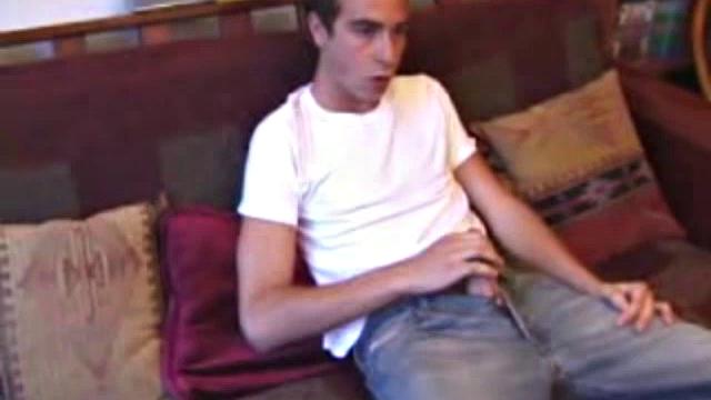 Vincenzo shows off his new purchase, strokes his cock, and uses a sex toy on the couch