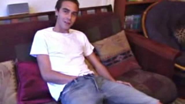 Vincenzo shows off his new purchase, strokes his cock, and uses a sex toy on the couch