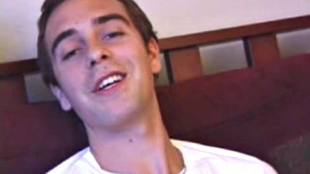 Vincenzo shows off his new purchase, strokes his cock, and uses a sex toy on the couch