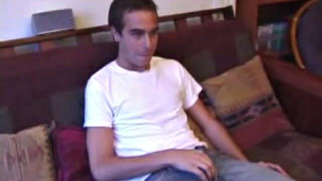 Vincenzo shows off his new purchase, strokes his cock, and uses a sex toy on the couch