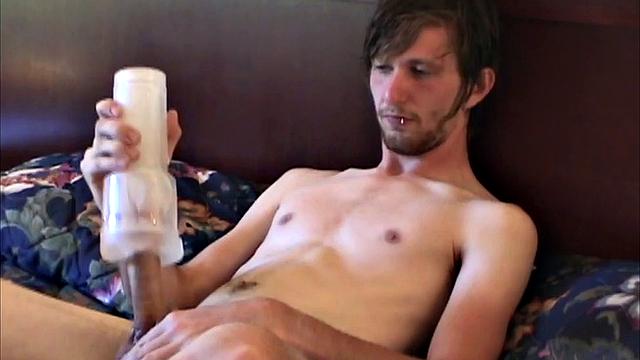 Eugene is the subject of this amateur homemade video. Auntie Bob mans the camera, as the young man lies naked and stroking up a boner. Once hard, the big bearded boy grabs a fleshlight and begins pleasuring himself.