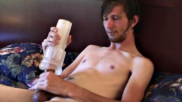 Eugene is the subject of this amateur homemade video. Auntie Bob mans the camera, as the young man lies naked and stroking up a boner. Once hard, the big bearded boy grabs a fleshlight and begins pleasuring himself.