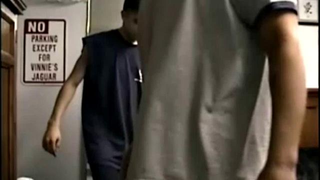 Curious Cory is horny and wants some of Vinnie's mouth on his cock. So, Vinnie pulls off his clothes and goes down on him. He strokes and sucks on Cory's cock, coaxing out a massive cum load, most of which he swallows.