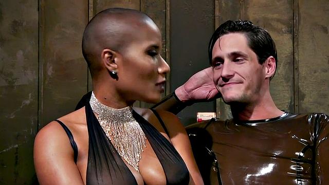 Black domina hits sissy balls and butt before bondage