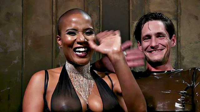 Black domina hits sissy balls and butt before bondage