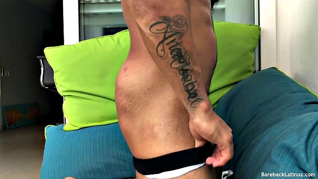 Our featured solo boy is a muscular and inked Latin stud by the name of Erik. Already naked, he kicks back on the patio, oils up, and starts working his uncut cock.