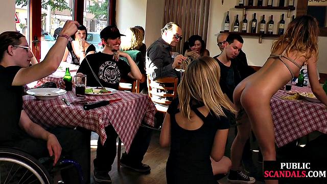 Tied chick giving head in public café