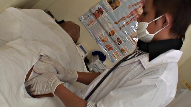 Asian stud gets a thorough check-up before being bred by medic in uniform