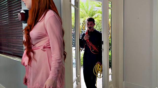 Hot redhead seduces and fucks a repairman in the kitchen