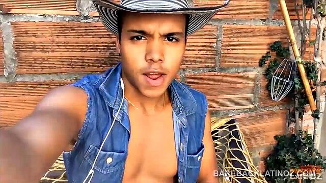 Our featured solo boy of the week is this cute Latin boy, who keeps his hat on the entire video. But, as the shorts peel off we can see a sexy little happy trail that leads to a monster uncut cock.