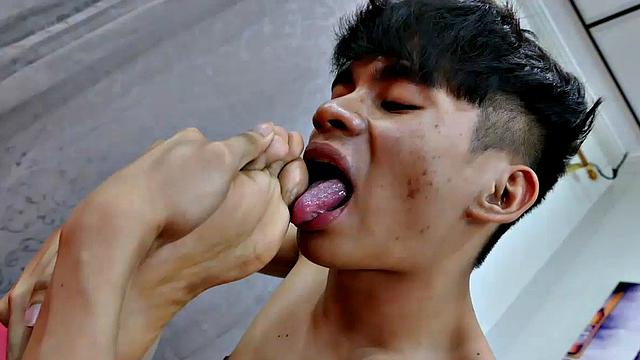 Asian Felix keeps a library of gay porn videos in his cell phone. He's a shy, quiet twink who is very self-conscious about his male feet fetish. But boy is he horny. He loves to jerk off to his gay porn.