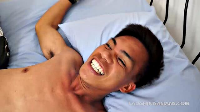 We tied Argie spreadeagled to the bed for some Laughing Asians tickling action. Vahn starts one on one with cute Asian boy Argie.