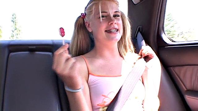 Cute petite teen in car plays with her pussy