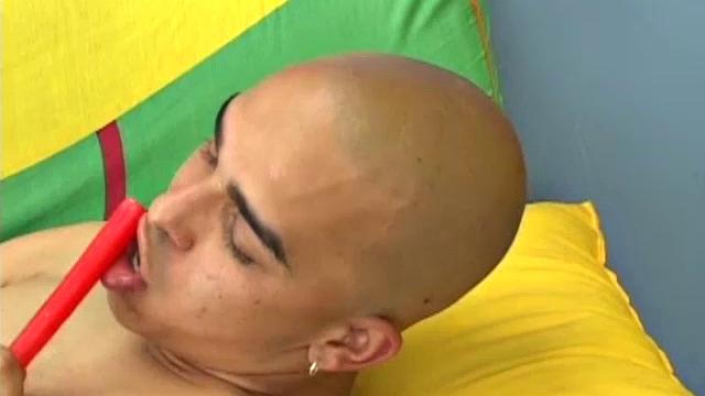 Kinky skinhead Latino Cristobal is on the sofa stripping down for jack off show. Once naked and rock hard, the boy shoves a candle stick up his ass.