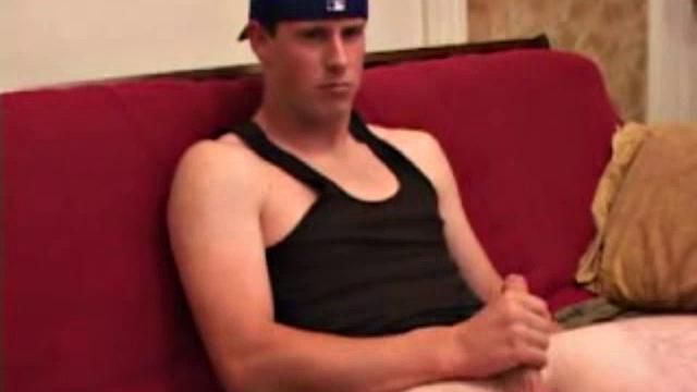 Young Maxx Wood works his cock under his shorts and then pulls it out to lube up. He strokes with determination, edging himself a few times, before covering his naked body in a splattering of warm cum.