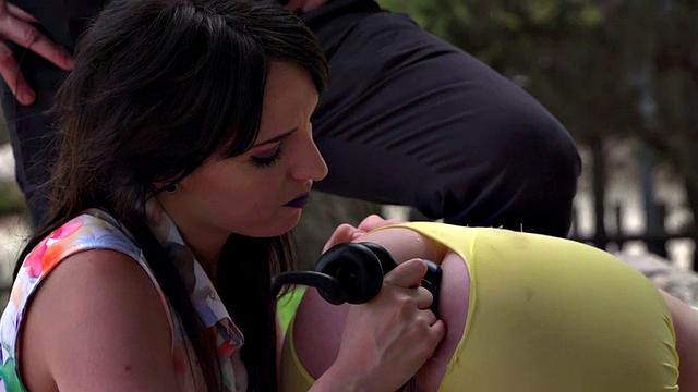 Public slut toyed outdoors by dominators in threesome