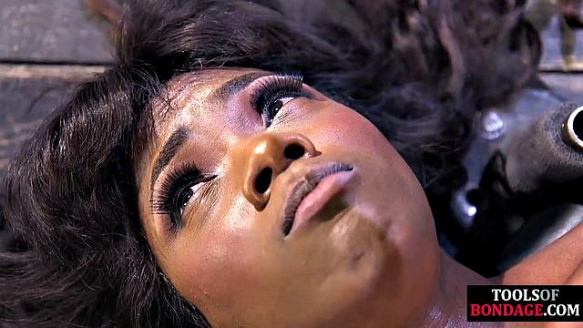 Hardtied ebony babe toyed by master