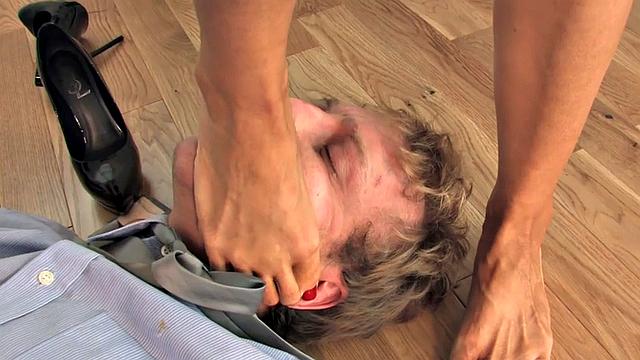 Trampling domina spanks butt of sissy in office