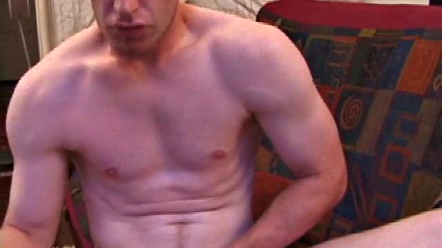 This fiery red head starts fully clothed and strips off in no time. Johnny Rapid is eager to show off. This hottie strokes his dick on the sofa, taking time to lube up really well before moving in for a close-up.