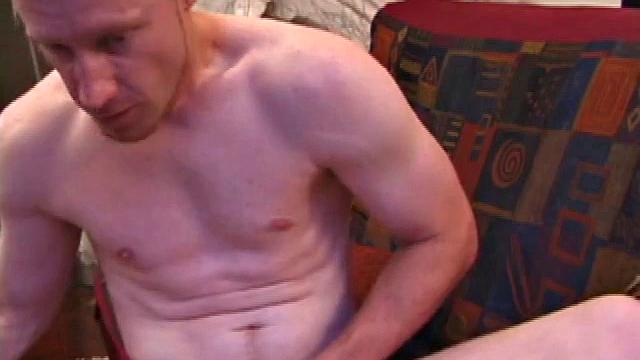 This fiery red head starts fully clothed and strips off in no time. Johnny Rapid is eager to show off. This hottie strokes his dick on the sofa, taking time to lube up really well before moving in for a close-up.