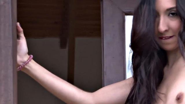 Brunette teen with small tits fingers herself in the sun while wearing a bikini