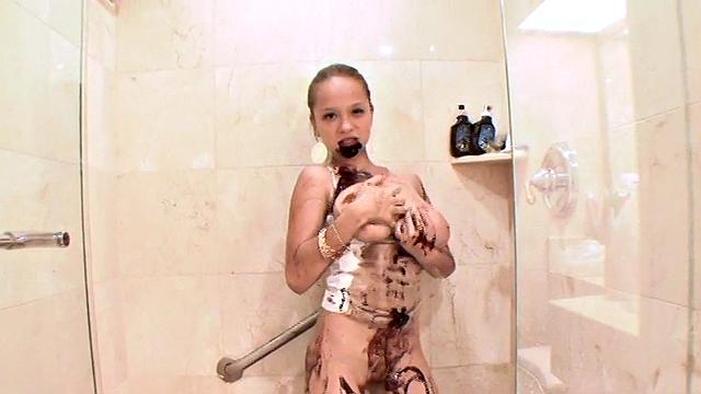 Teen Paris Milan showers her body in chocolate