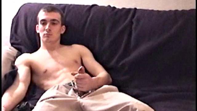 Darrell kicks back on the sofa, makes himself comfortable, rubs his package to work up a bulge, and then releases a big cock. At the same time, he pulls off his dress shirt and tie.