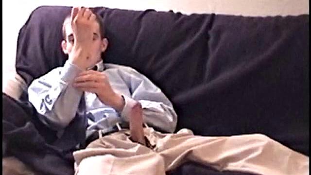 Darrell kicks back on the sofa, makes himself comfortable, rubs his package to work up a bulge, and then releases a big cock. At the same time, he pulls off his dress shirt and tie.