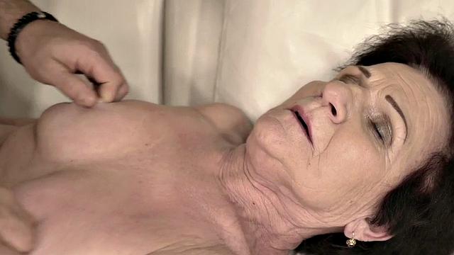 Kinky granny with hairy pussy and big tits takes a hard pounding from a lucky stud