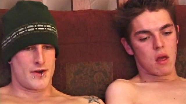 These 4 horny boys turn to porn to make their afternoon go by quickly. Pants come off and soon each is seated on the couch with cock in hand.