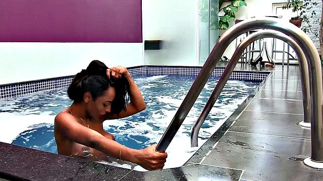 Shemale Adrielhy Bronze takes a dip and a squirt