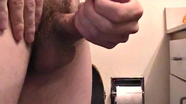 Dan can't resist stroking his hard cock for the camera