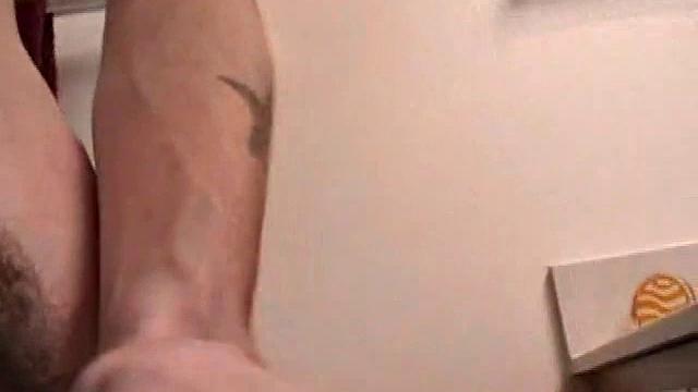 Dan can't resist stroking his hard cock for the camera