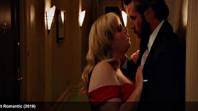 Liam Hemsworth strips and wraps a towel around his waist