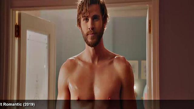 Liam Hemsworth strips and wraps a towel around his waist