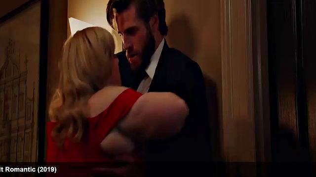 Liam Hemsworth strips and wraps a towel around his waist