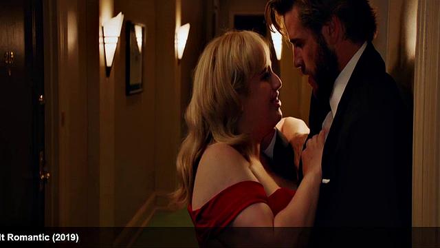 Liam Hemsworth strips and wraps a towel around his waist