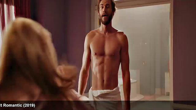 Liam Hemsworth strips and wraps a towel around his waist