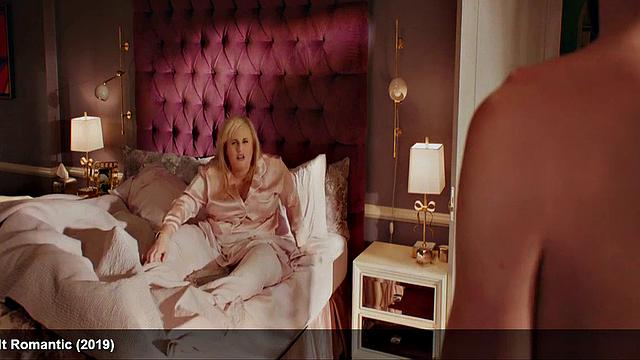 Liam Hemsworth strips and wraps a towel around his waist