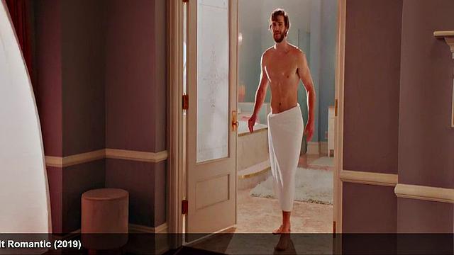 Liam Hemsworth strips and wraps a towel around his waist