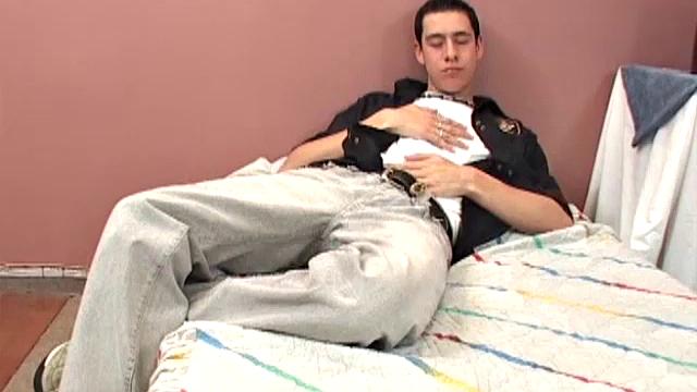 After enjoying a few rounds of paint ball, Gustavo heads home to enjoy some self-pleasuring on his bed. The Latino strips out of his clothes and grabs his big uncut cock.