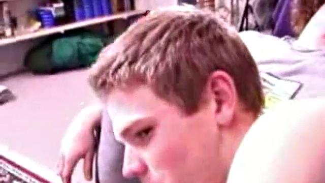 Adam and Christian sit next to each other on the couch watching a porno. They unzip and stoke for a bit, before taking turns sucking each other's hard cock.