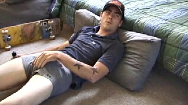 Dan gets down on the floor and starts watching a porn video. He goes right for his cock and plays with himself until he's boned up. Rolling the head with his palm, Dan lubes up his hot dick.