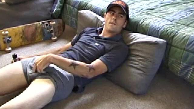 Dan gets down on the floor and starts watching a porn video. He goes right for his cock and plays with himself until he's boned up. Rolling the head with his palm, Dan lubes up his hot dick.