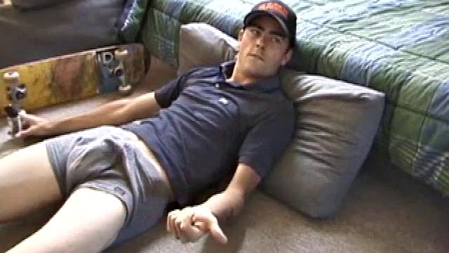 Dan gets down on the floor and starts watching a porn video. He goes right for his cock and plays with himself until he's boned up. Rolling the head with his palm, Dan lubes up his hot dick.