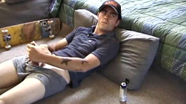 Dan gets down on the floor and starts watching a porn video. He goes right for his cock and plays with himself until he's boned up. Rolling the head with his palm, Dan lubes up his hot dick.