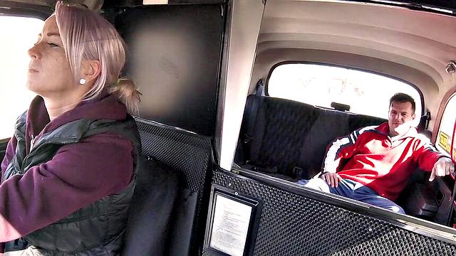 Tattooed driver with big tits rides hard while getting her pussy fingered