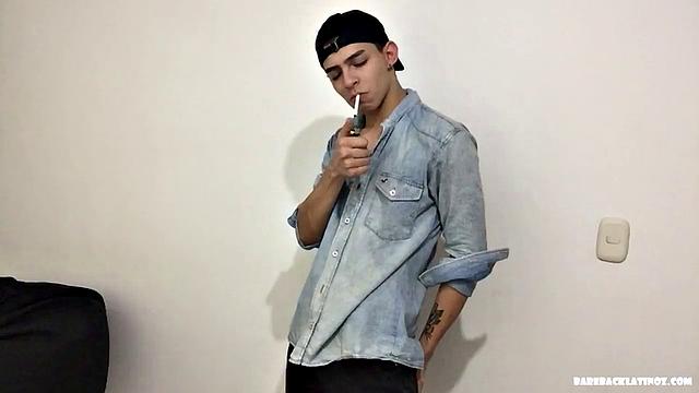 Paul is a skinny Latino, who starts his solo standing and teases us, as he strips naked. By the time the clothes are on the floor, Paul is fingering his ass and working up a boner.